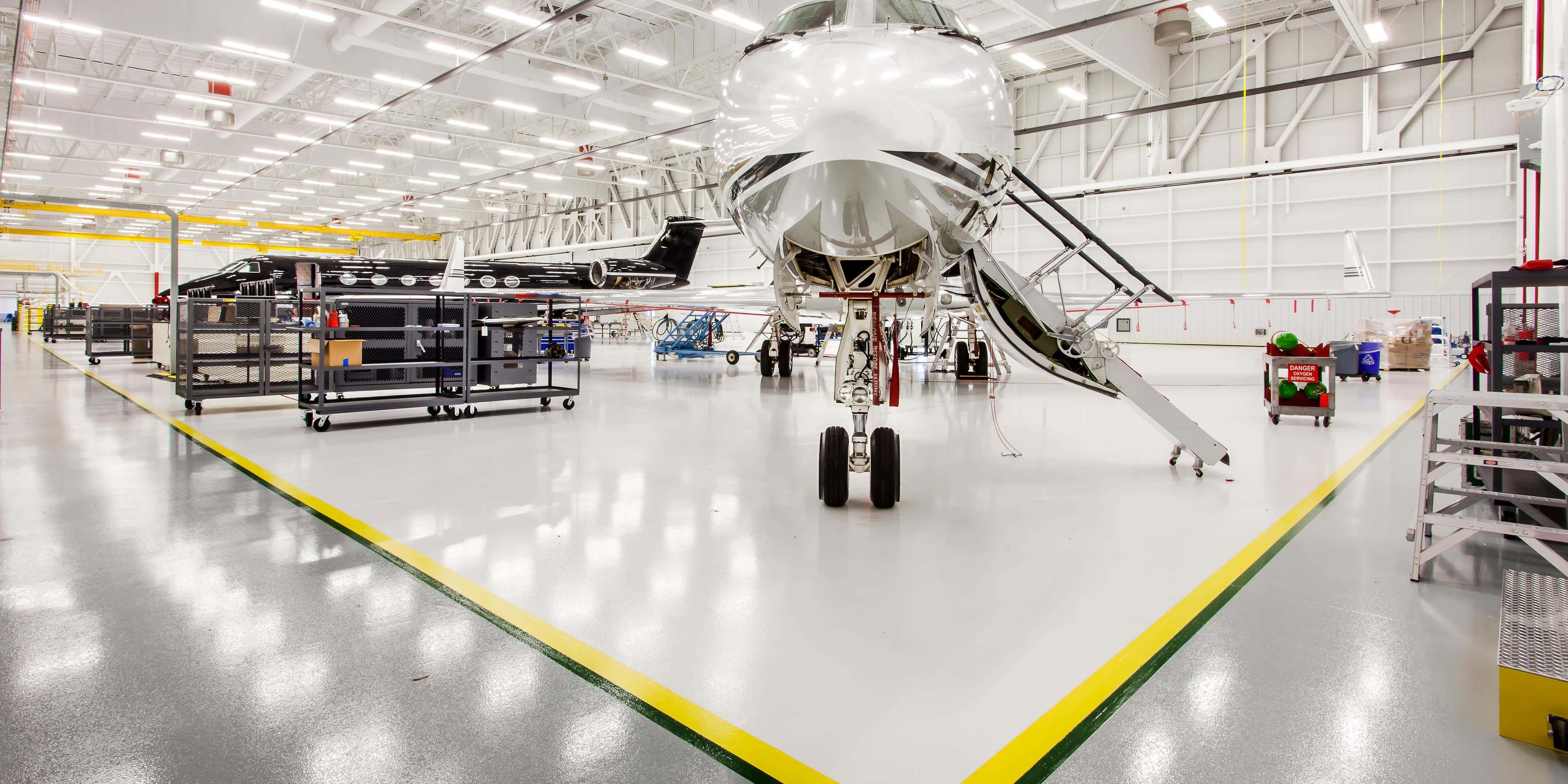Resinous floor coating and sealant inside airplane hangar