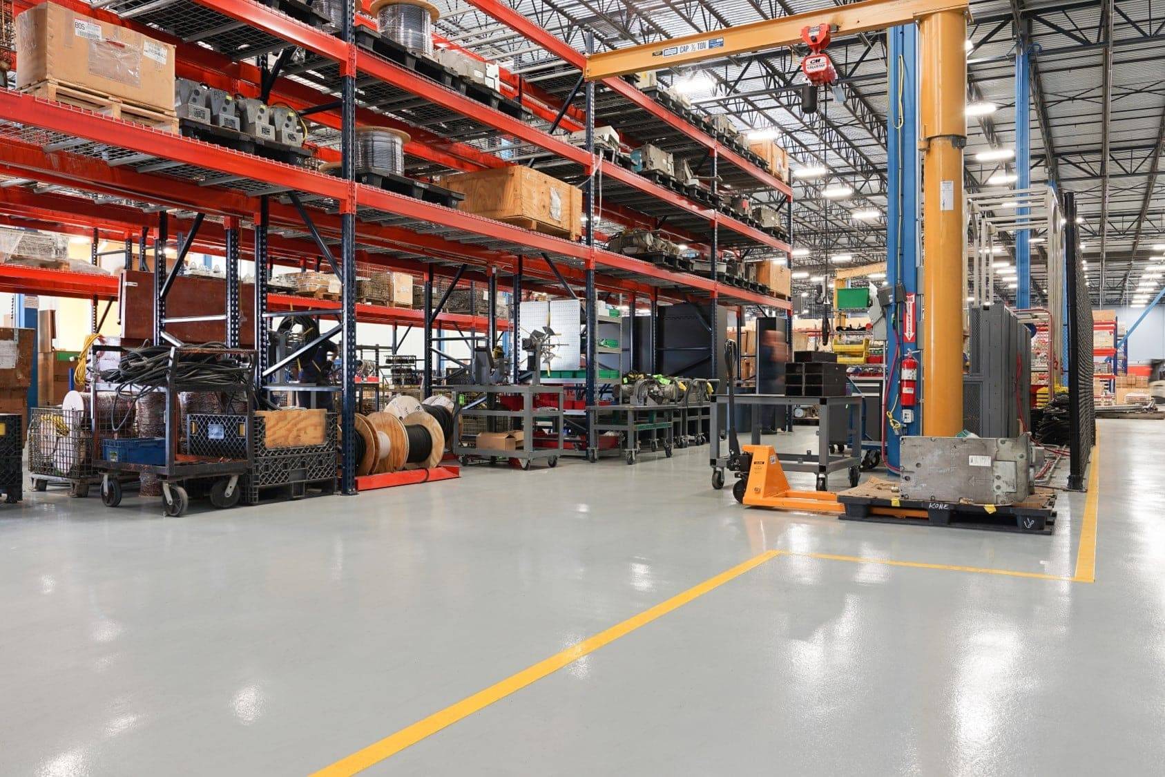 Resinous flooring and shelving inside industrial warehouse